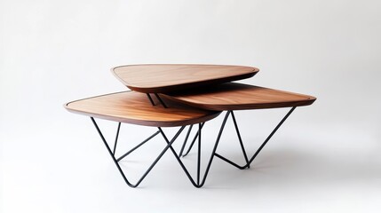Modern walnut wood nesting coffee tables with black metal legs.