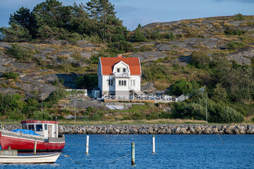 seaside house on swedish rocky coastline.