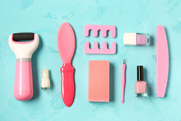 Set of professional tools for pedicure with nail polishes on grunge blue background