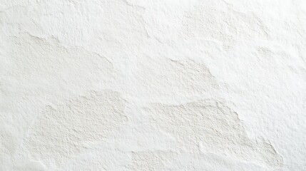 Photograph of textured, off-white concrete wall with subtle irregularities and surface marks.