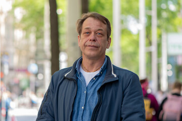 Fototapeta premium Portrait of a middle-aged man with short hair and a slight smile.