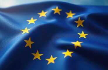 Closeup shot of European Union flag waving in wind. Blue background with yellow stars. EU symbol of unity, democracy, cooperation, freedom, peace. Represents community, government, political