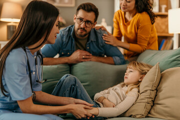 Pediatrician visiting sick girl at home with family support