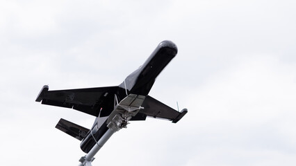 Military Drone in Action During Aerial Reconnaissance Operation Amid Ongoing Conflict in a War-Torn Region, Showcasing Advanced Technological Capabilities