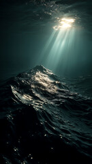 Fototapeta premium Sunbeams pierce the dark ocean depths, illuminating rolling waves in a display of nature's raw beauty. Deep blue and sunlight contrast.