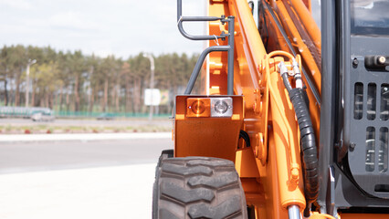 Construction Equipment Operating in a War Zone, Demonstrating Heavy Machinery Use in a Conflict...