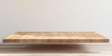Empty light brown wooden shelf against a white wall