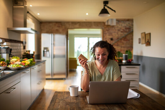 Middle aged female food nutritionist and blogger talking to her audience and clients while promoting a health supplement and vitamins in the form of pills or tablets