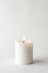 White candle flame burns bright isolated on white background. Candlelight creates cozy atmosphere, evokes feeling of peace, relaxation, serenity. Perfect for holidays, spa, meditation, romantic date.