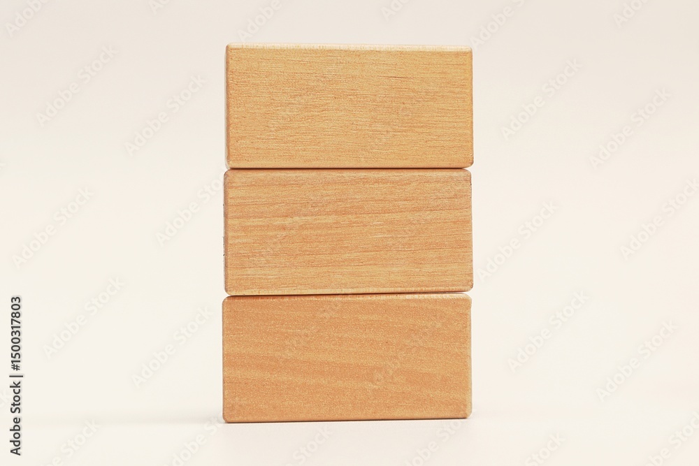 Fototapete Stack of empty wooden blocks for written text on white background