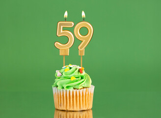 Birthday card with candle and cupcake - Number 59 on a green background