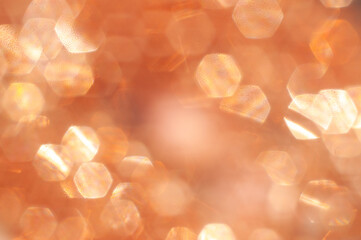 Light reflections create a warm, shimmering texture in a close-up shot