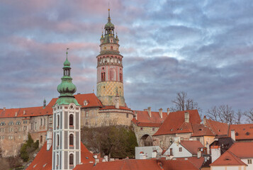 Fototapeta premium Sunrise view of historic towers and rooftops in Cesky Krumlov, Czech Republic