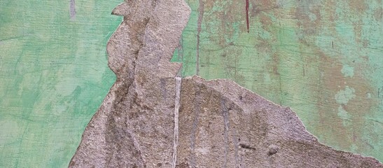 Fototapeta premium Abstract Texture of Peeling Green Paint on Old Wall