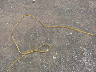 Bright Yellow Electrical Cable on Ground