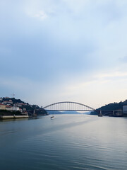 Obraz premium Douro River with Maria Pia Bridge and Sao Joao Bridge - Porto, Portugal