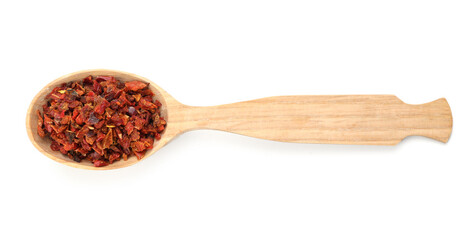 Red chili pepper flakes in wooden spoon isolated on white, top view