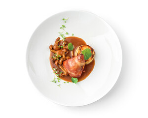 Baked rabbit leg with vegetable puree and mushrooms in plate isolated on white background. Meat dishes, top view, close up
