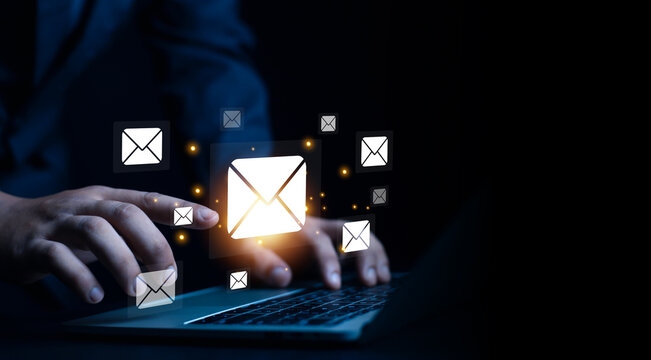 New email notification concept, business online communication, email communication, digital marketing, businessman responding to floating digital interface showing new email notification symbol.
