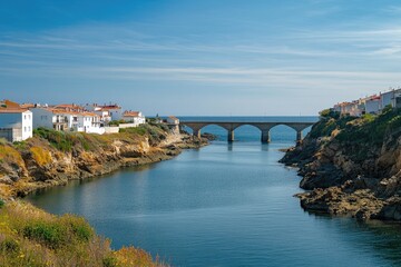 Coastal town nestled beside a tranquil waterway with an arched bridge