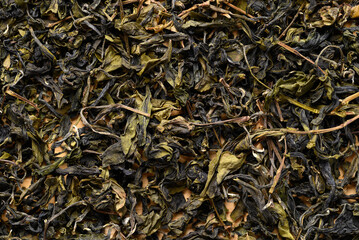 Dried green tea leaves texture background, Healthy drink