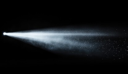 Bright light beam,  spraying mist,  dark background