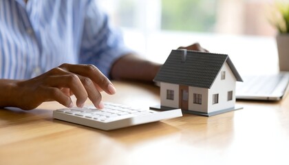 Woman calculates home buying costs.