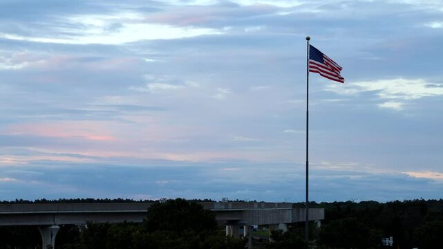 Washington DC USA A Washington DC Metro line under a large American flag at Dulles Airport.