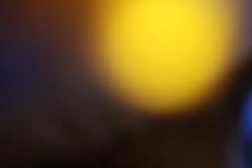 A grainy surface with a subtle gradient from yellow to dark gray