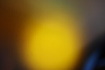 A grainy surface with a subtle gradient from yellow to dark gray