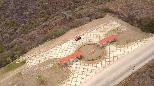 Drone shot of a viewpoint. Drone videos of a viewpoint on a hill adjacent to the beach,