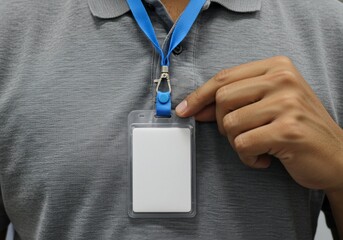 Man shows blank ID card on lanyard. Workplace or event access/identification