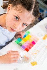 Naklejka premium Colorful Clay Beads Set for Creative Kids' Bracelet Making