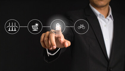 Businessman in a suit touches a virtual lock icon on a digital interface with various connected technology symbols.