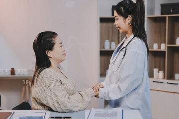 Fototapeta premium Medicine doctor hand reassuring her female patient