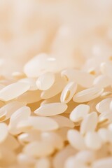 Macro shot of uncooked white rice grains.  Texture, food, ingredient, culinary background.