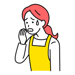 動揺しているエプロン姿の女性