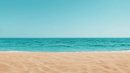 Obraz premium Minimalist beach scene featuring smooth sand meeting vibrant turquoise water under a clear blue sky, creating a serene and idyllic backdrop