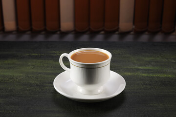 cup of tea on the table with saucer 