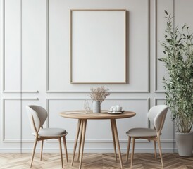 Minimalist dining nook with light wood table, two chairs, a blank framed poster, and a potted plant against a white paneled wall