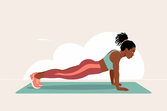 Woman performing push-ups for fitness at home in morning