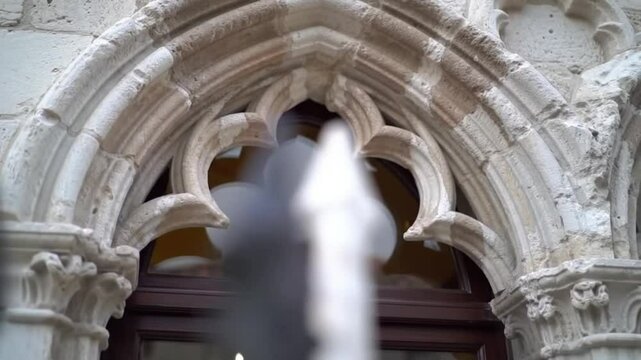 Intricate Gothic arch window with stone tracery detail