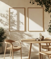 Sunlit minimalist room featuring two blank, light wood framed posters, a round wooden table with chairs, and potted plants casting shadows