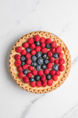 Fresh berry cake homemade traditional gourmet sweet dessert bakery food decorated with berries on marble