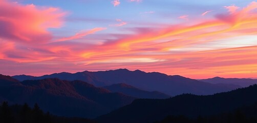 Obraz premium Fiery orange and purple hues paint the Smoky Mountains at sunset, silhouettes of trees against a vibrant sky, scenery, majestic