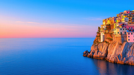Breathtaking coastal view at sunset featuring colorful houses perched on rocky cliffs beside calm blue waters under a pastel sky.