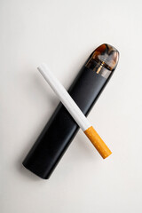 Cigarette, rolled tobacco in paper with a filter tube, and a vape or electronic cigarette are isolated on a white background. No or quit smoking, a bad habit, and unhealthy