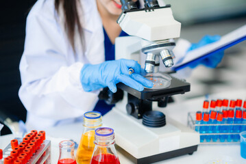 Female biotechnologist testing new chemical substances in a laboratory.
