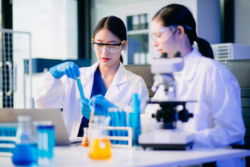 Biologist taking experiment with plants working in biochemistry laboratory.