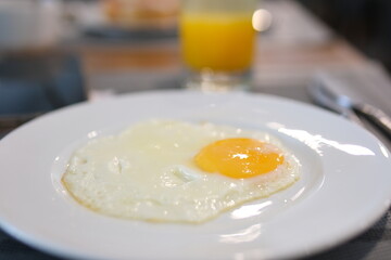 Egg juice plate English breakfast on table Traditional breakfast foods include eggs, orange juice. Cozy and inviting breakfast scene, perfect for food themes, highlighting delicious breakfast 